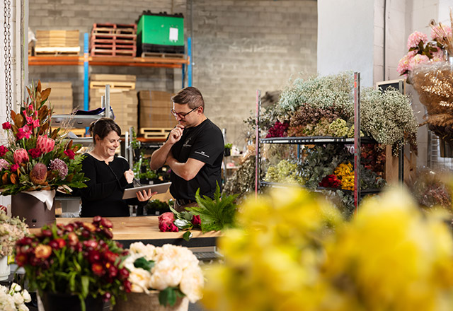 Employers speaking in a flower shop